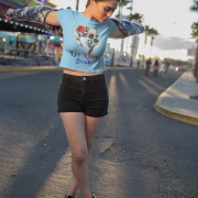 "Let Love Soar Tee – Romantic Dove & Rose Design in Sky Blue by PodLyft." A refreshing sky-blue tee featuring a pair of doves carrying roses, paired with uplifting typography. Ideal for a cool and calming style.