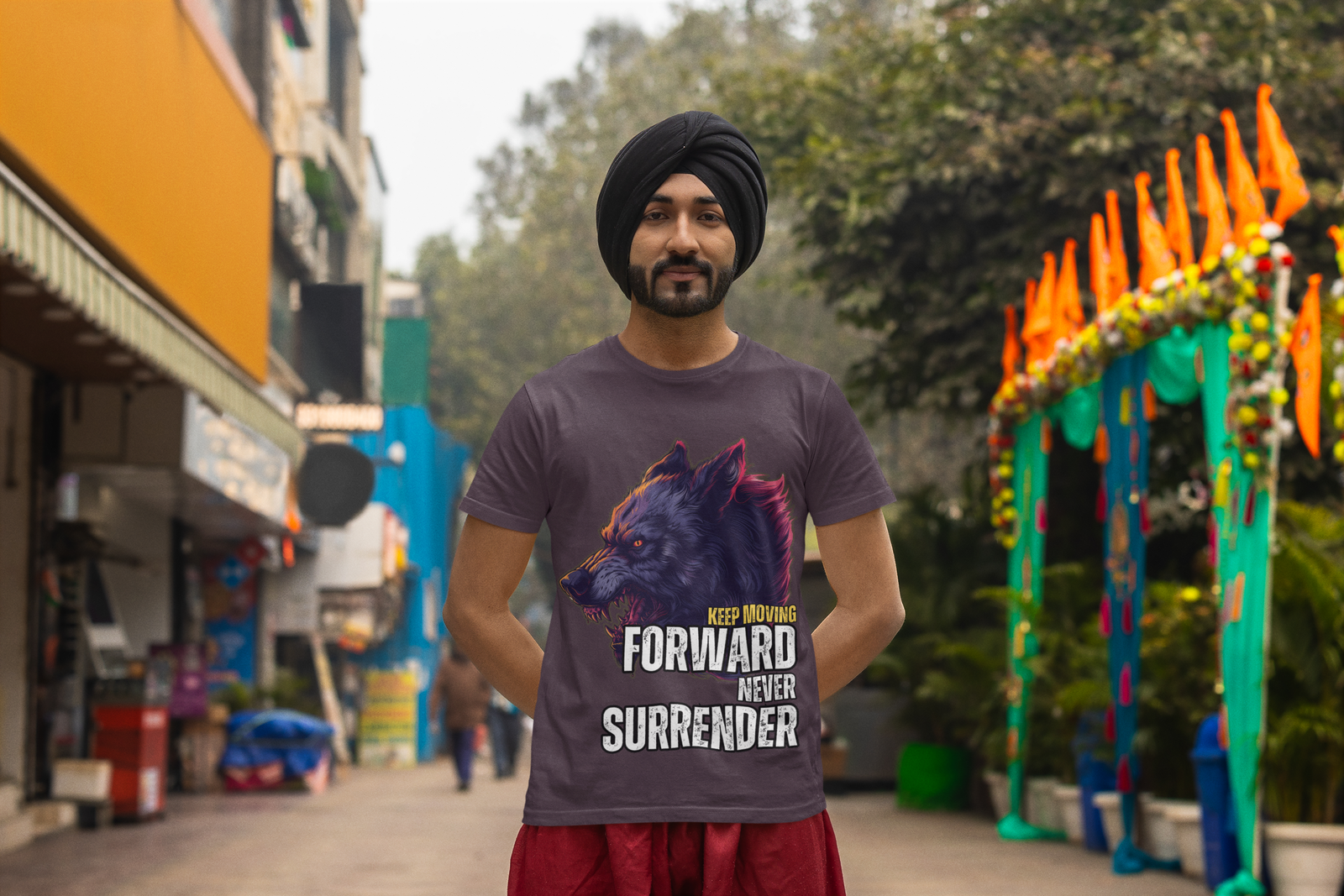 Man standing confidently in a bustling marketplace, wearing the Relentless Wolf Tee in charcoal. The design features a fierce wolf graphic with bold motivational text: 'Keep Moving Forward, Never Surrender.' A perfect fit for those with a determined mindset. Available at PodLyft.