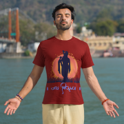 Spiritual Krishna Tee in maroon, designed with an elegant Lord Krishna silhouette playing the flute, set against a radiant sunset with 'जय श्रीकृष्ण' in beautiful script. Perfect for devotees and Krishna lovers.