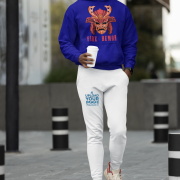 Men’s Fire Demon Samurai Hoodie by PodLyft in navy blue, on a mannequin, featuring a bold red and orange samurai helmet design with a demonic face and 'FIRE DEMON' text, displayed in a modern store with blurred clothing racks in the background.