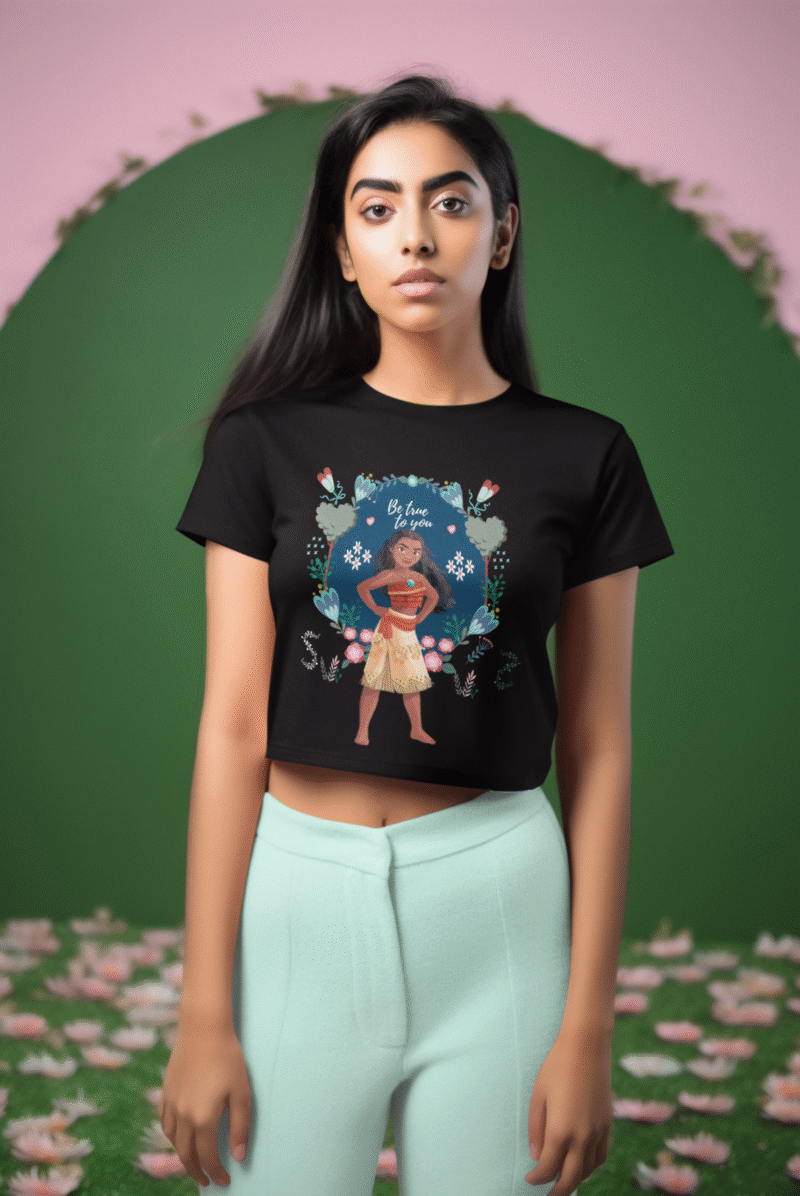 Woman wearing a black Be true to you crop top with a Moana illustration by PodLyft