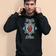 Model wearing a black 'Official Darth Maul Hoodie' by PodLyft, featuring a bold red-and-black Darth Maul graphic with yellow eyes, framed in a teal and mint green diamond pattern, with 'Dark' and 'Side' in gothic white text, paired with grey jeans against a plain beige background.