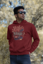 A maroon Men's Tough Spirit Hoodie from PodLyft, showcasing a striking streetwear design with gritty, expressive graphics, combining comfort with a bold aesthetic.
