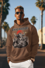 Man wearing a brown hoodie with a bold Viking warrior Hoodie. Standing confidently outdoors with palm trees in the background, embodying a fierce and rugged Norse aesthetic.