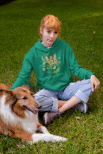 A bottle green Nature Angel Hoodie from PodLyft, showcasing a fairy-inspired design, perfect for fairy style enthusiasts.