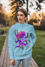 Women’s Vibrant Floral Sweatshirt in baby blue with Stay Bright design by PodLyft, displaying cheerful floral graphics for a fresh look.