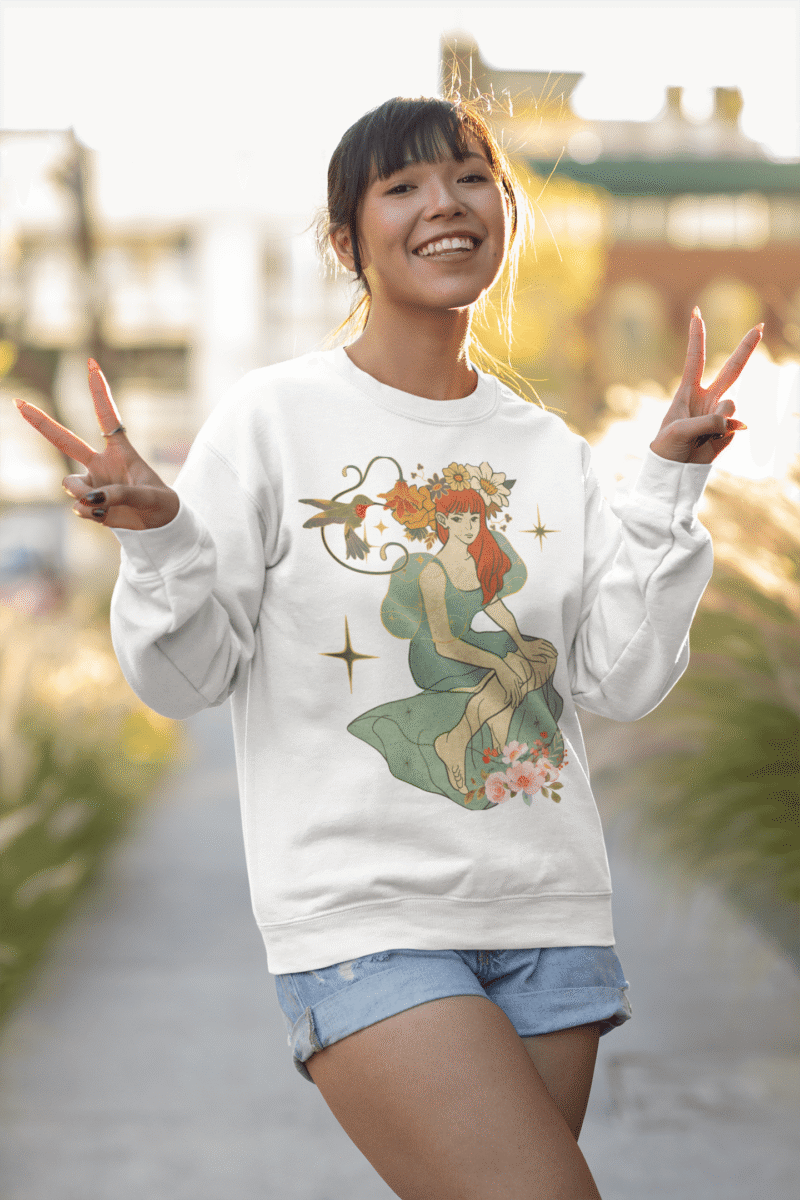 A white Women’s Nature Muse Sweatshirt with a vintage look from PodLyft, featuring a DTG-printed nature-inspired design with floral and leafy patterns on the front, shown against a white background.