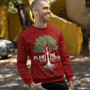 A smiling man wearing a maroon PodLyft Men's Plant the Future Sweatshirt, featuring a prominent tree design with roots and the text "PLANT THE FUTURE," posing outdoors with his hands in his pockets.