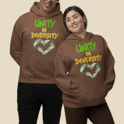 Two diverse models wear matching brown UNITY in DIVERSITY hoodies from PodLyft featuring a bold "UNITY in DIVERSITY" slogan in green and yellow graffiti-style text. Below the text is a powerful heart-shaped design made of interlocking hands in varying skin tones, symbolizing inclusion, equality, and social unity. This cause-based hoodie represents pride in diversity and is part of PodLyft’s mission-driven streetwear collection.