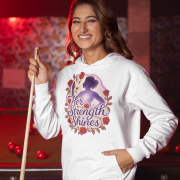 A young woman, possibly of East Asian descent, with dark hair, wearing a white PodLyft women's empowered hoodie. The hoodie features an abstract graphic with geometric shapes and subtle lines in shades of purple and pink, conveying a message of empowerment. She is smiling confidently, holding a small purple clutch bag, standing against a blurred outdoor background.