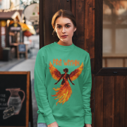 A young woman, possibly of Caucasian descent with light brown hair, wearing a mint green PodLyft women's Fire Within sweatshirt. The sweatshirt features a graphic of a human heart with stylized flames emanating from its top, and the text "FIRE WITHIN" is written above and below it. She is smiling and looking towards the camera, standing against a plain light grey background.