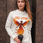 A young woman, possibly of Caucasian descent with light brown hair, wearing a white PodLyft women's Fire Within sweatshirt. The sweatshirt features a graphic of a human heart with stylized flames emanating from its top, and the text "FIRE WITHIN" written above and below it. She is looking directly at the camera with a subtle smile, standing against a plain light grey background.