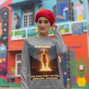 A young woman, possibly of South Asian descent, with long dark hair, wearing a grey PodLyft Yagyaseni Fireborn sweatshirt. The sweatshirt features a stylized graphic of a woman's silhouette against a fiery, abstract background, with the text "YAGYASENI" written below. She is looking directly at the camera with a confident expression, her arms crossed, standing against a plain light grey background.