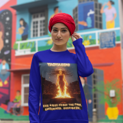 A young woman, possibly of South Asian descent, with long dark hair, wearing a navy blue PodLyft Yagyaseni Fireborn sweatshirt. The sweatshirt features a stylized graphic of a woman's silhouette against a fiery, abstract background, with the text "YAGYASENI" written below. She is looking directly at the camera with a confident expression, her arms crossed, standing against a plain light grey background.