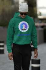 A young man, possibly of Caucasian descent, with short dark hair and a beard, wearing a bottle green PodLyft Men's Forging Your Character hoodie. The hoodie features a circular graphic with the letters "FYC" prominently in the center, surrounded by text that includes "Find Your Calm." He is looking directly at the camera with a confident expression, standing against a plain light grey background.