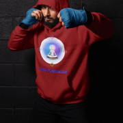 A young man, possibly of Caucasian descent, with short dark hair and a beard, wearing a maroon PodLyft Men's Forging Your Character hoodie. The hoodie features a circular graphic with the letters "FYC" prominently in the center, surrounded by text that includes "Find Your Calm." He is looking directly at the camera with a confident expression, standing against a plain light grey background.