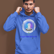 A young man, possibly of Caucasian descent, with short dark hair and a beard, wearing a royal blue PodLyft Men's Forging Your Character hoodie. The hoodie features a circular graphic with the letters "FYC" prominently in the center, surrounded by text that includes "Find Your Calm." He is looking directly at the camera with a confident expression, standing against a plain light grey background.