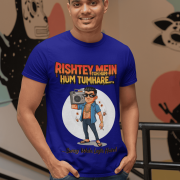 A young man, possibly of Caucasian descent, with short dark hair and a beard, wearing a navy blue PodLyft Men's Bollywood Swag T-shirt. The t-shirt features a graphic with a funny movie dialogue. He is looking directly at the camera with a confident expression, standing against a plain light grey background.