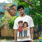 A young man, possibly of Caucasian descent, with short dark hair and a beard, wearing a white PodLyft oversized Light Up T-shirt. The t-shirt features a graphic of a cartoon-style couple and the flirty text, "Baby You Are Like Diya, You Light Up My World." He is looking directly at the camera with a confident expression, standing against a plain light grey background.