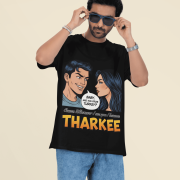 A young man, possibly of Caucasian descent, with short dark hair and a beard, wearing a black PodLyft t-shirt. The t-shirt features a humorous graphic with the Hindi word "THARKEE." He is looking directly at the camera with a confident expression, standing against a plain light grey background.