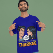 A young man, possibly of Caucasian descent, with short dark hair and a beard, wearing a navy blue PodLyft t-shirt. The t-shirt features a humorous graphic with the Hindi word "THARKEE." He is looking directly at the camera with a confident expression, standing against a plain light grey background.
