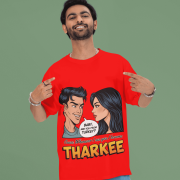 A young man, possibly of Caucasian descent, with short dark hair and a beard, wearing a red PodLyft t-shirt. The t-shirt features a humorous graphic with the Hindi word "THARKEE." He is looking directly at the camera with a confident expression, standing against a plain light grey background.
