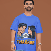 A young man, possibly of Caucasian descent, with short dark hair and a beard, wearing a royal blue PodLyft t-shirt. The t-shirt features a humorous graphic with the Hindi word "THARKEE." He is looking directly at the camera with a confident expression, standing against a plain light grey background.
