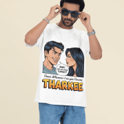 A young man, possibly of Caucasian descent, with short dark hair and a beard, wearing a royal blue PodLyft t-shirt. The t-shirt features a humorous graphic with the Hindi word "THARKEE." He is looking directly at the camera with a confident expression, standing against a plain light grey background.
