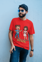 PodLyft Cheesy Pickup Line T-shirt in bright red, modeled by a man with a beard and sunglasses leaning against a wall. The shirt displays the funny pizza pickup line graphic.
