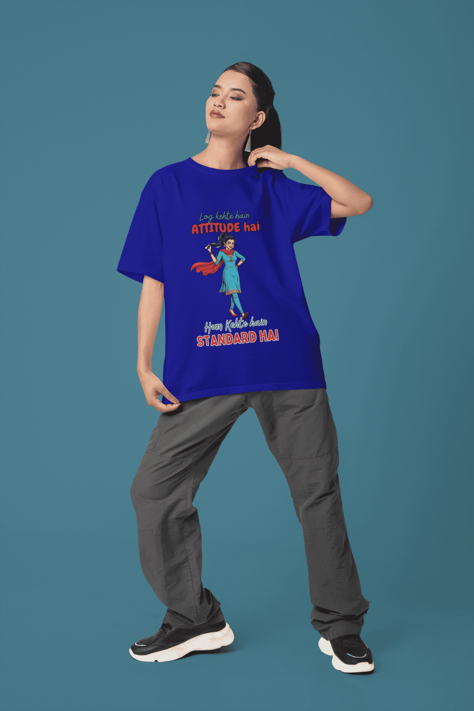 Navy Blue Desi Swag Oversized Tee for women from PodLyft. A stylish dark blue graphic t-shirt with a "Standard Hai" Hindi slogan and a colorful illustration of a woman in traditional wear.
