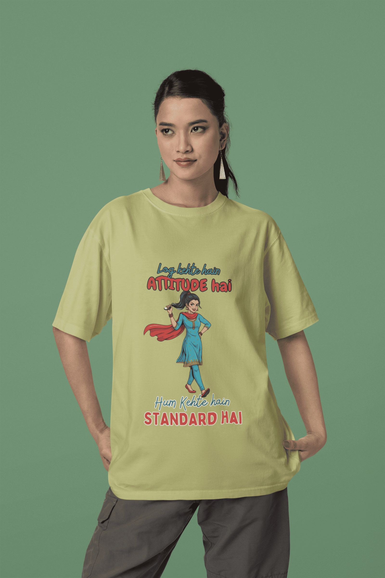 Olive Green Desi Swag Oversized Tee by PodLyft. A casual light green t-shirt featuring a sarcastic attitude quote in Hindi and English typography.