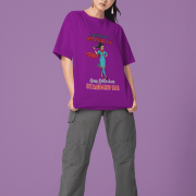 Purple Desi Swag Oversized Tee by PodLyft. A model wearing sunglasses and cargo pants showcases a bold purple t-shirt with a confident Hindi slogan.