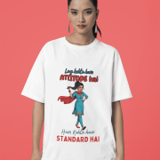 White Desi Swag Oversized Tee by PodLyft. A classic white t-shirt featuring a vibrant print of a Desi girl and a bold attitude quote, posed against a red background.