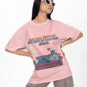 Baby Pink Modern Beti Oversized T-shirt – Zero Kaam Attitude Edition by PodLyft. A woman wearing sunglasses poses in a pastel pink graphic t-shirt with a funny illustration about skipping housework.